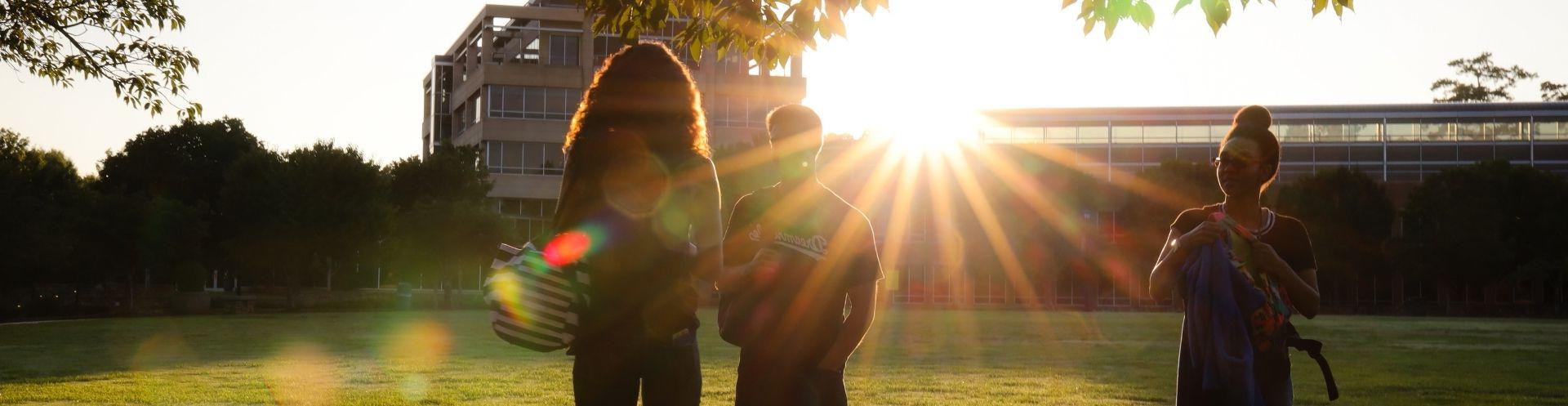 ksu students standing outside campus in sunlight